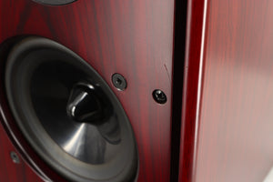 Close up of a used Harbeth P3ESR Standmount Speaker in a rosewood finish showing scratch on fascia