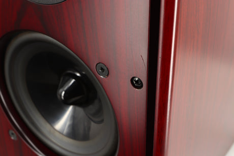 Close up of a used Harbeth P3ESR Standmount Speaker in a rosewood finish showing scratch on fascia