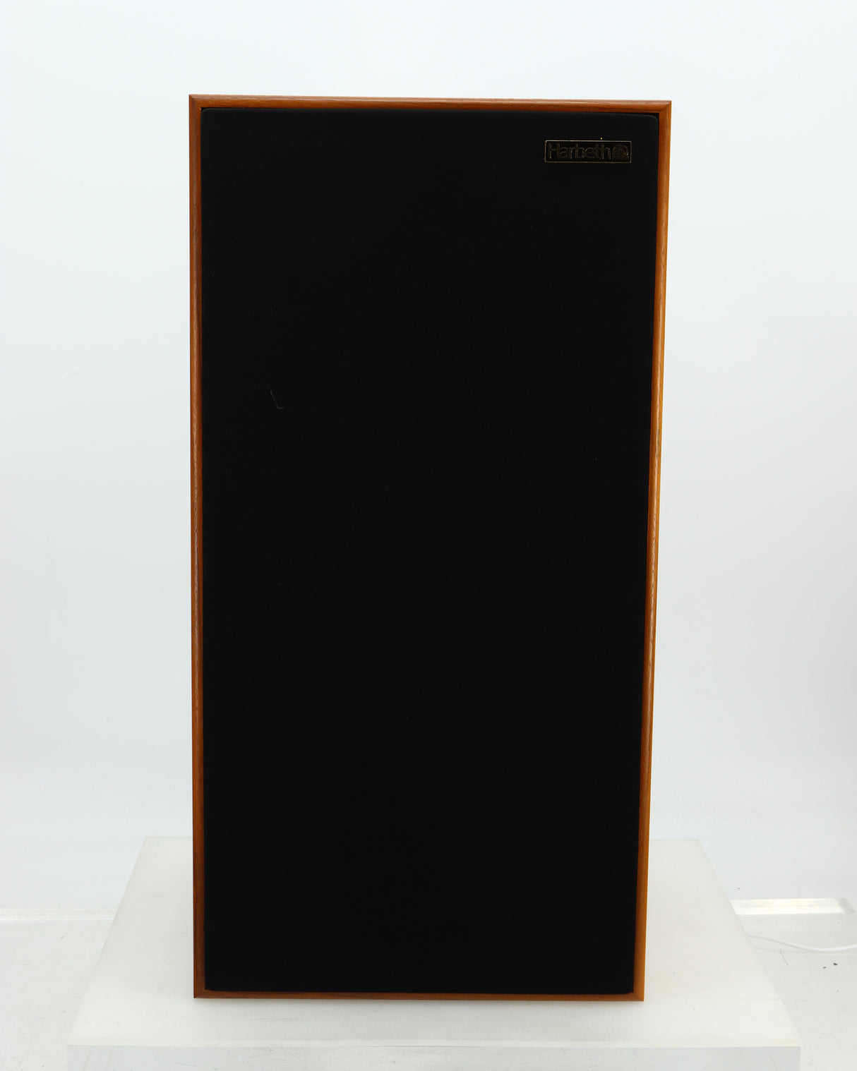 Front view of a used Harbeth Super HL5 Plus 40th Anniversary Standmount Speaker in a walnut finish showing the grille