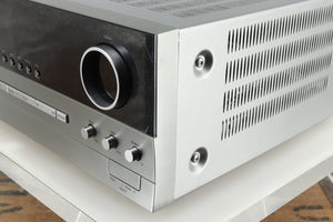 Front right corner of a used Harman Kardon 3380 Receiver in a silver finish