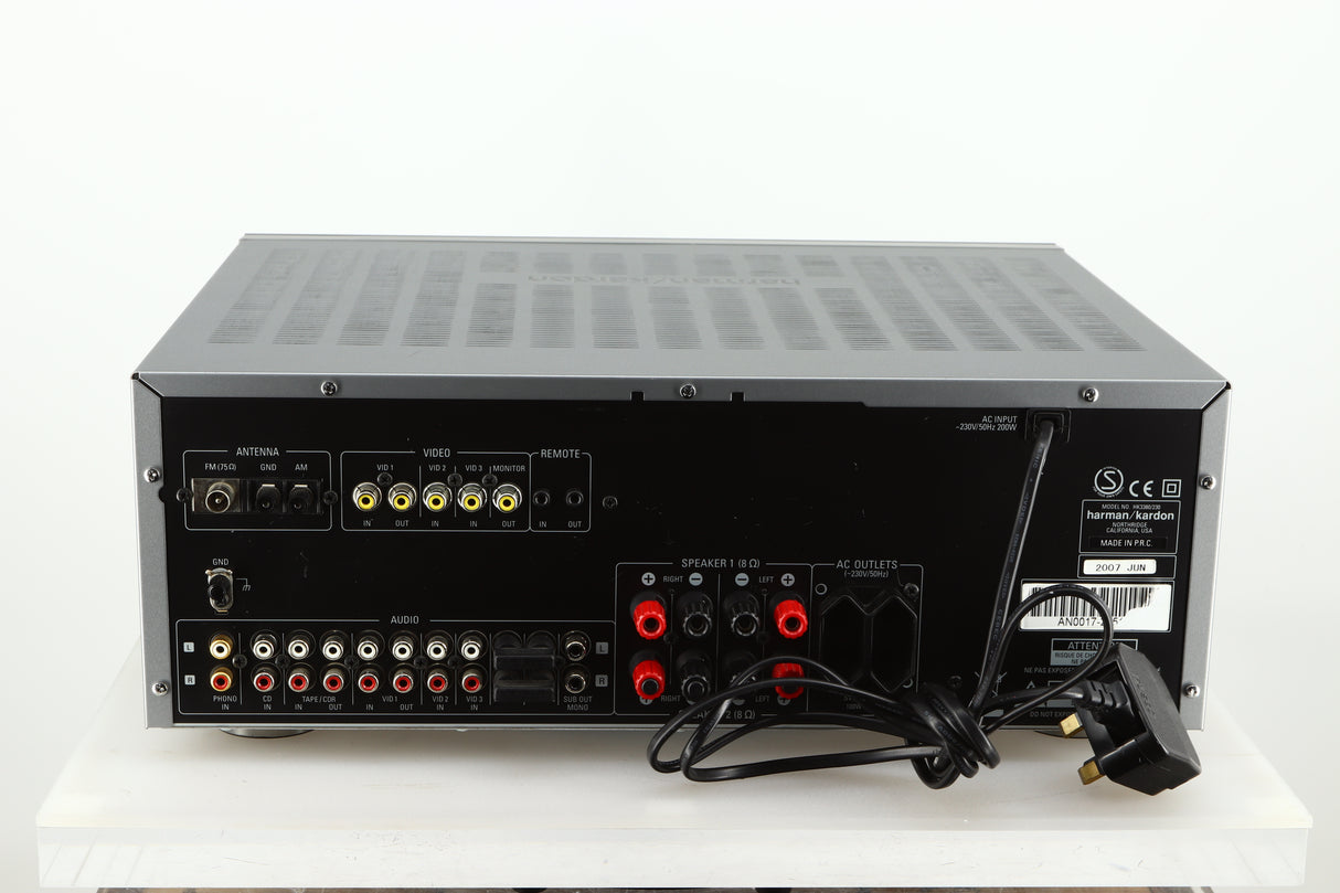 Rear view of a used Harman Kardon 3380 Receiver in a silver finish showing Phono Inputs and Outputs and Speaker Terminals