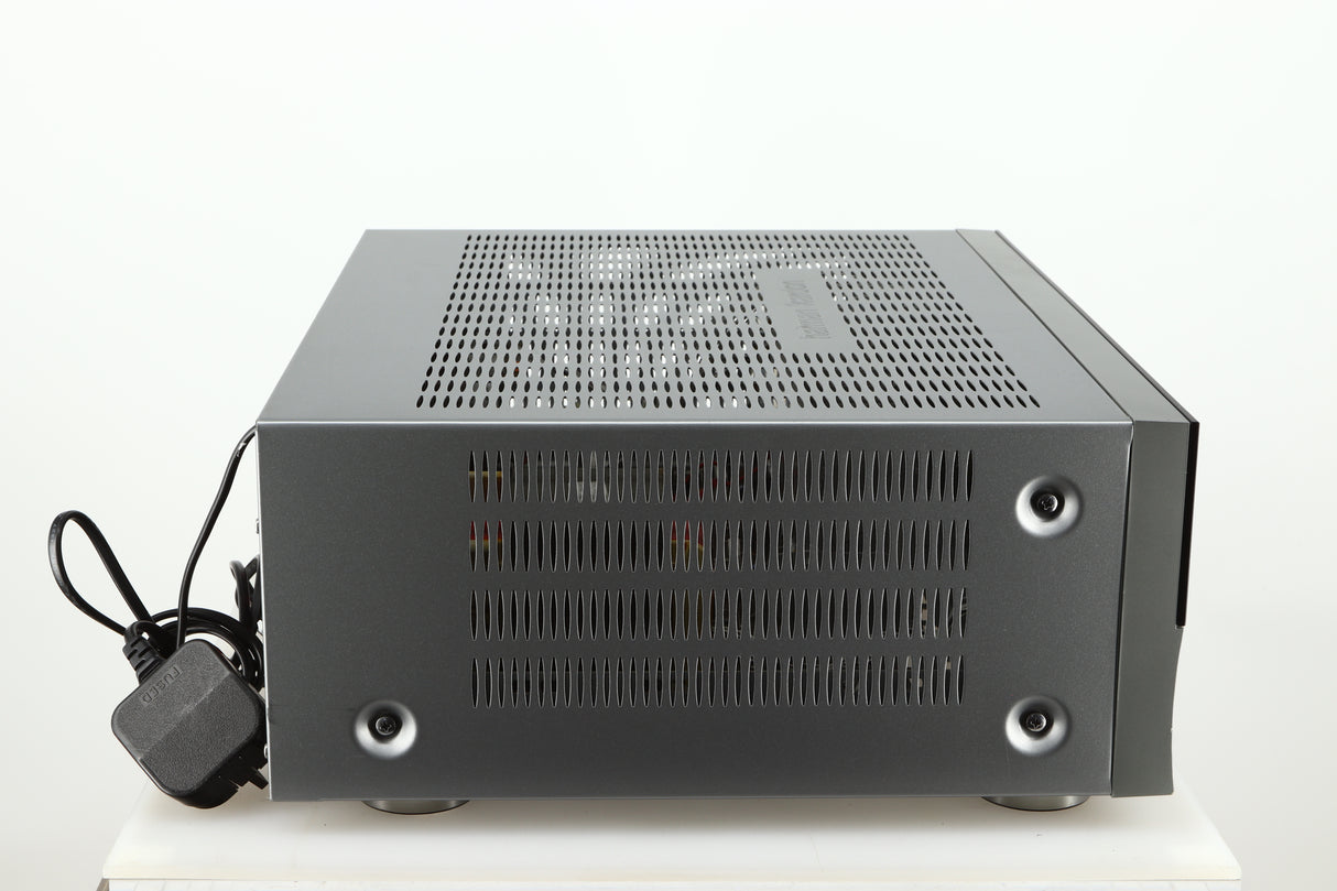 Left side view of a used Harman Kardon 3380 Receiver in a silver finish