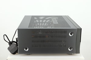 Left side view of a used Harman Kardon 3380 Receiver in a silver finish