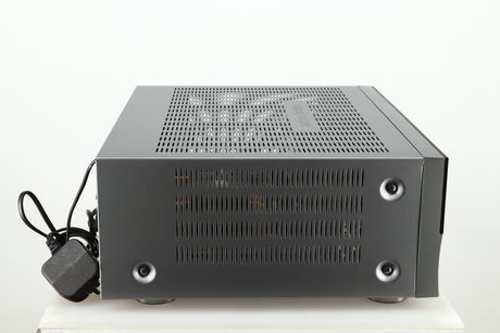 Left side view of a used Harman Kardon 3380 Receiver in a silver finish