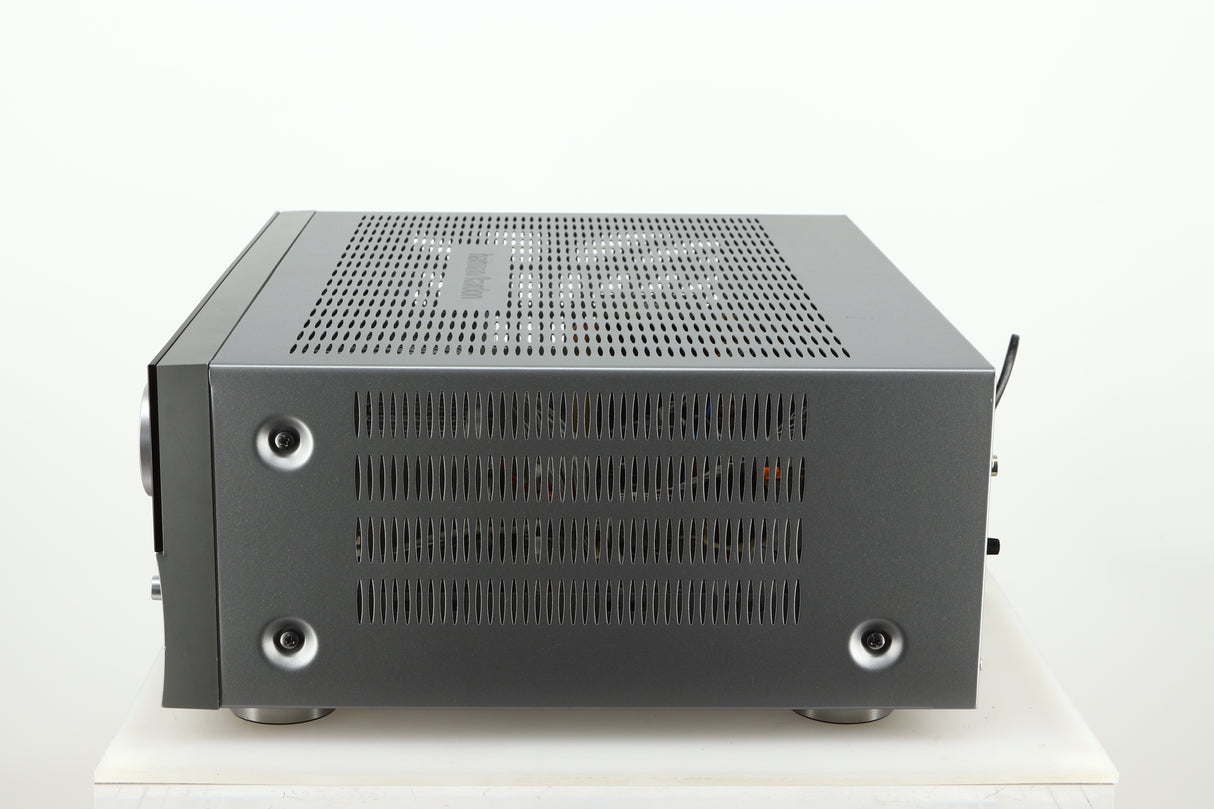 Right side view of a used Harman Kardon 3380 Receiver in a silver finish