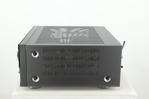 Right side view of a used Harman Kardon 3380 Receiver in a silver finish
