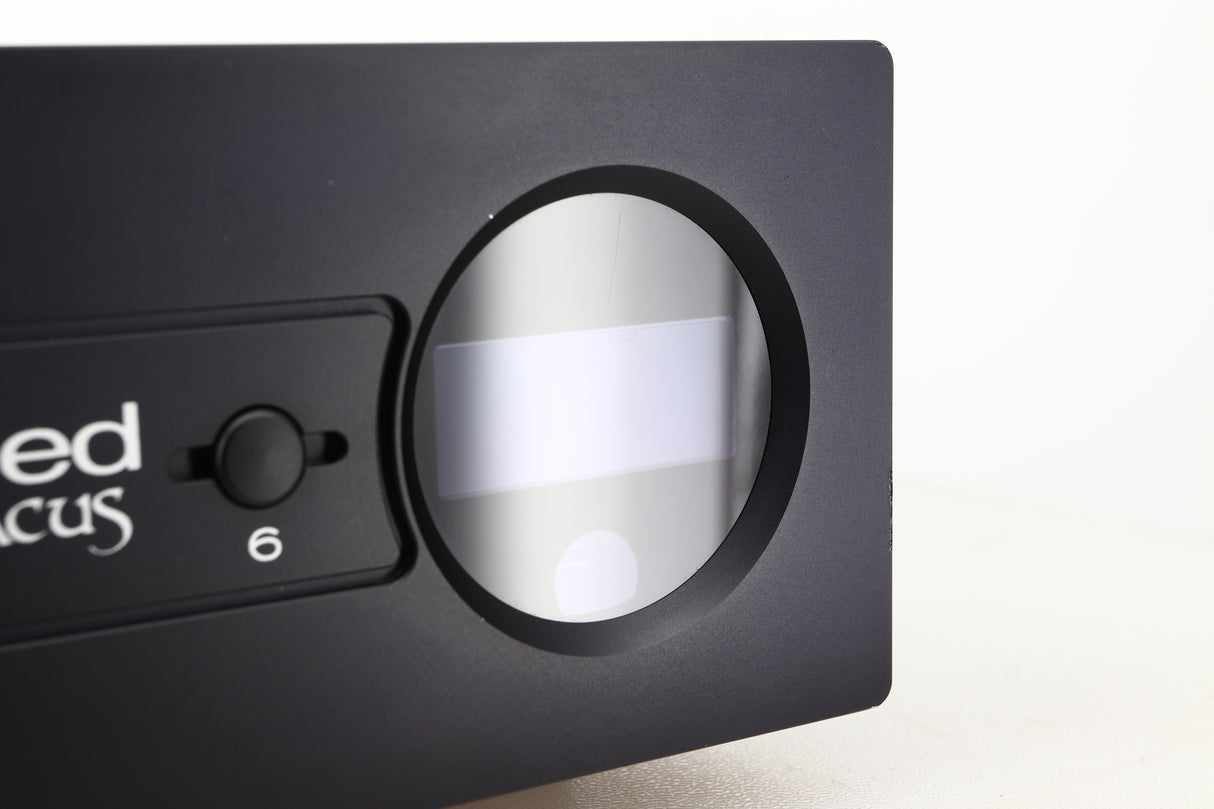 Close up view of a used Heed Abacus DAC in Black finish showing a faint scratch on the display