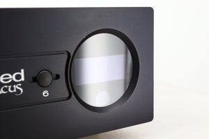 Close up view of a used Heed Abacus DAC in Black finish showing a faint scratch on the display