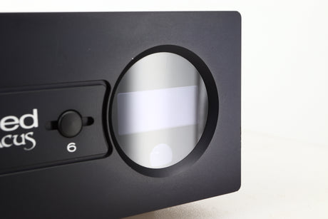 Close up view of a used Heed Abacus DAC in Black finish showing a faint scratch on the display