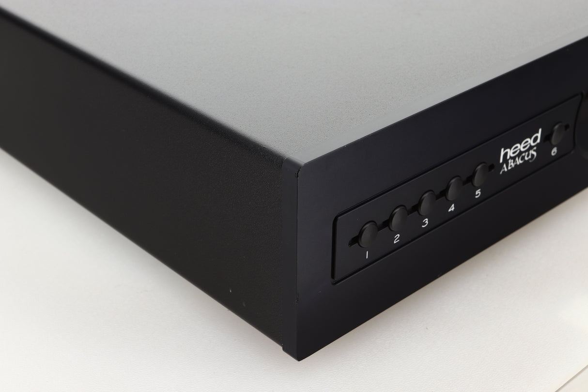 Front left corner view of a used Heed Abacus DAC in Black finish