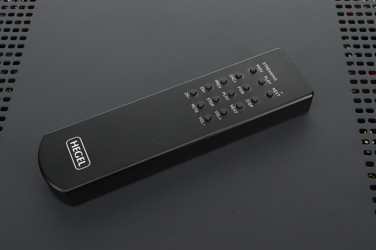 Close up view of a remote of a used Hegel H400 Streaming Amplifier in Black finish 