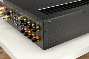 Rear left corner of a used HiFi ROSE RA280 Integrated Amplifier in a black finish
