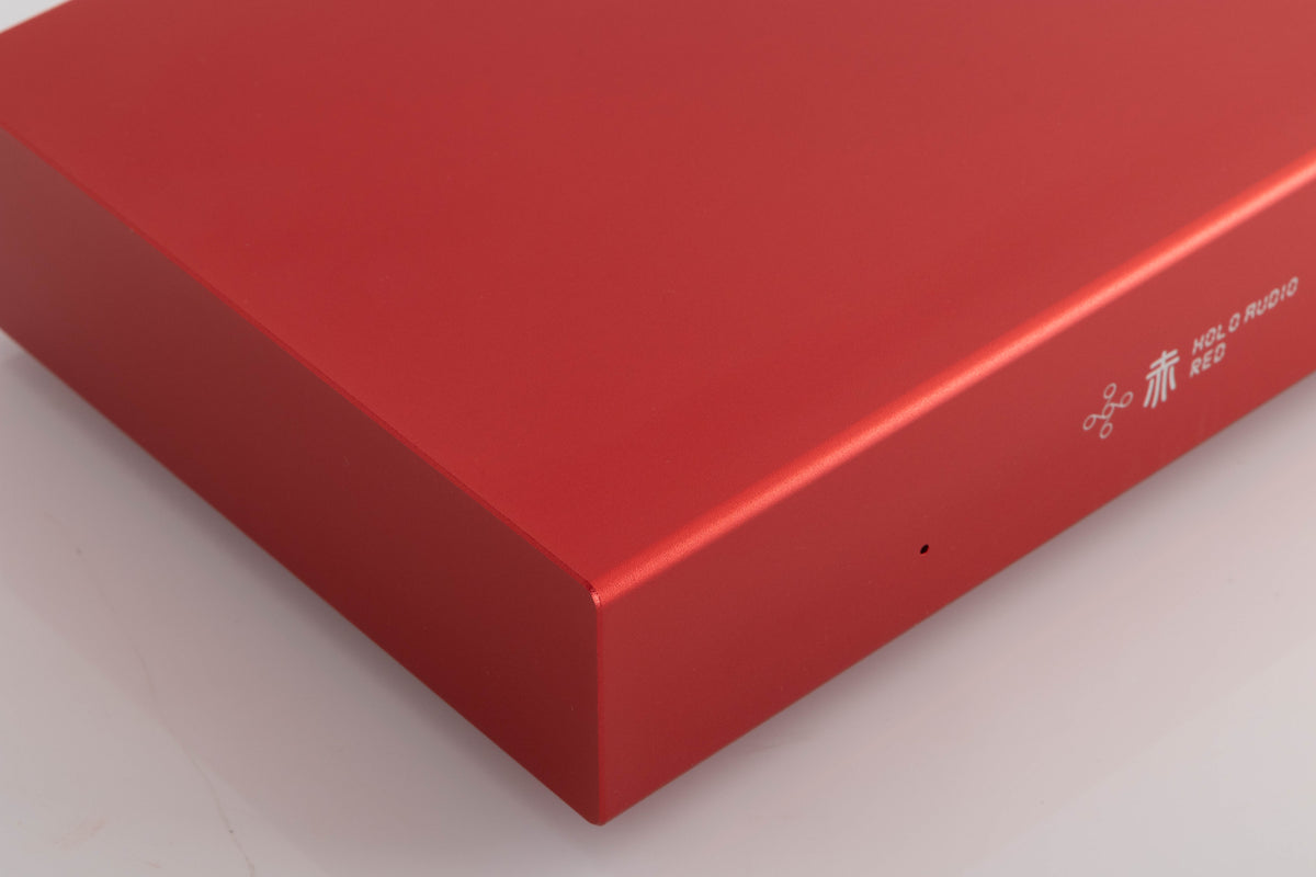 Front left corner of a used Holo Audio Red Network Streamer in a Red finish