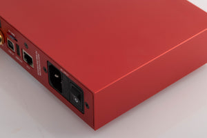 Rear left corner of a used Holo Audio Red Network Streamer in a Red finish