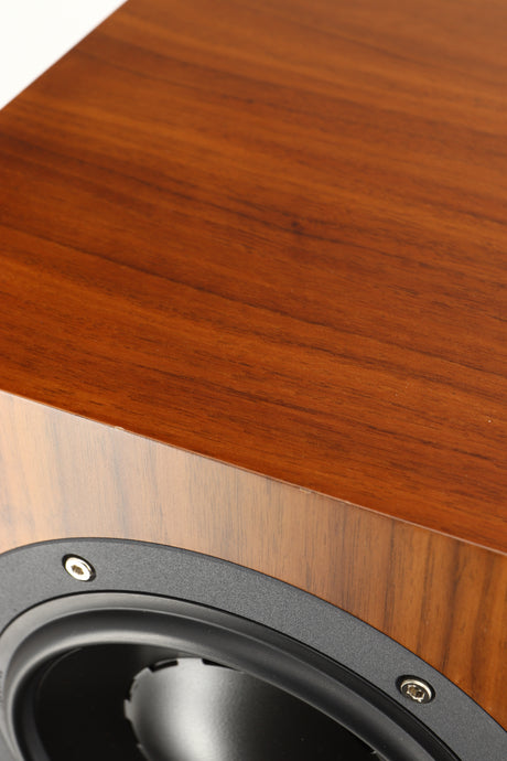 Close up of a used Icon Audio MFV3 Floorstanding Speaker in a rosewood vinyl finish showing scratching on front top edge