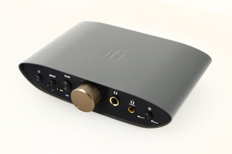 Close up of a used iFi Audio Zen Air Can Headphone Amplifier showing some marks and scratches on fascia