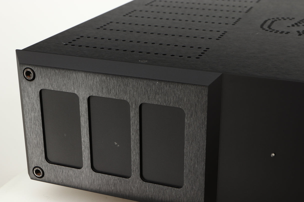 Close up of a used Isotek Nova Mains Conditioner in a black finish showing small nick on fascia
