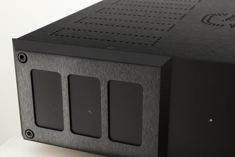 Close up of a used Isotek Nova Mains Conditioner in a black finish showing small nick on fascia