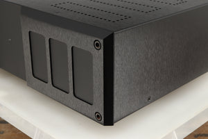 Front right corner of a used Isotek Nova Mains Conditioner in a black finish