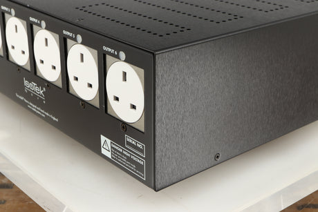 Rear left corner of a used Isotek Nova Mains Conditioner in a black finish