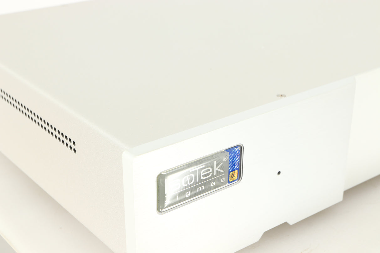 Close up of a used Isotek Sigmas Gil Power Distribution in a silver finish showing logo