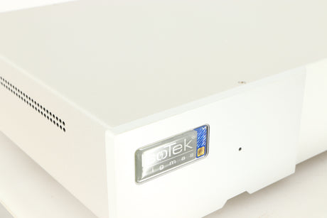 Close up of a used Isotek Sigmas Gil Power Distribution in a silver finish showing logo