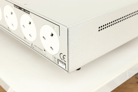 Rear left corner of a used Isotek Sigmas Gil Power Distribution in a silver finish