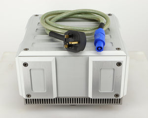 Top of a used Isotek Titan Mains Conditioner in a silver finish showing Mains Cable