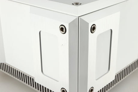 Close up of a used Isotek Titan Mains Conditioner in a silver finish showing some scratching