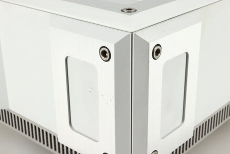 Close up of a used Isotek Titan Mains Conditioner in a silver finish showing some scratching