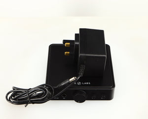 Top of a used JDS Labs Atom Headphone Amplifier in a black finish showing PSU