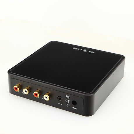 Close up of a used JDS Labs Atom Headphone Amplifier in a black finish showing rear