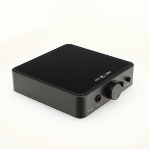 Front left corner of a used JDS Labs Atom Headphone Amplifier in a black finish