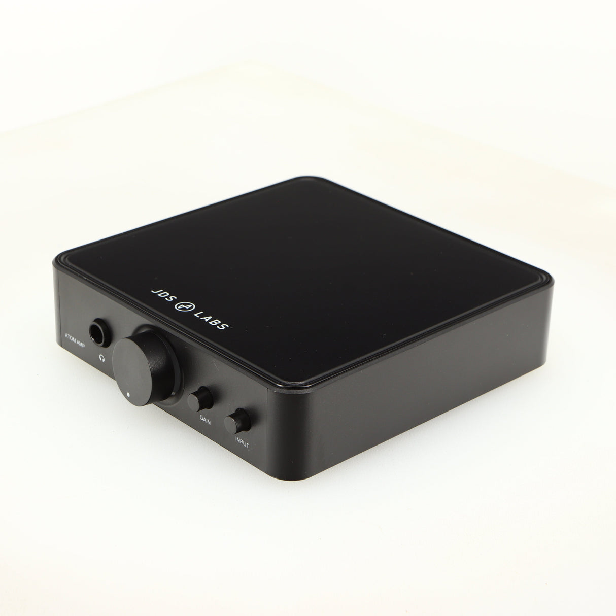 Front right corner of a used JDS Labs Atom Headphone Amplifier in a black finish