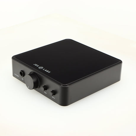 Front right corner of a used JDS Labs Atom Headphone Amplifier in a black finish