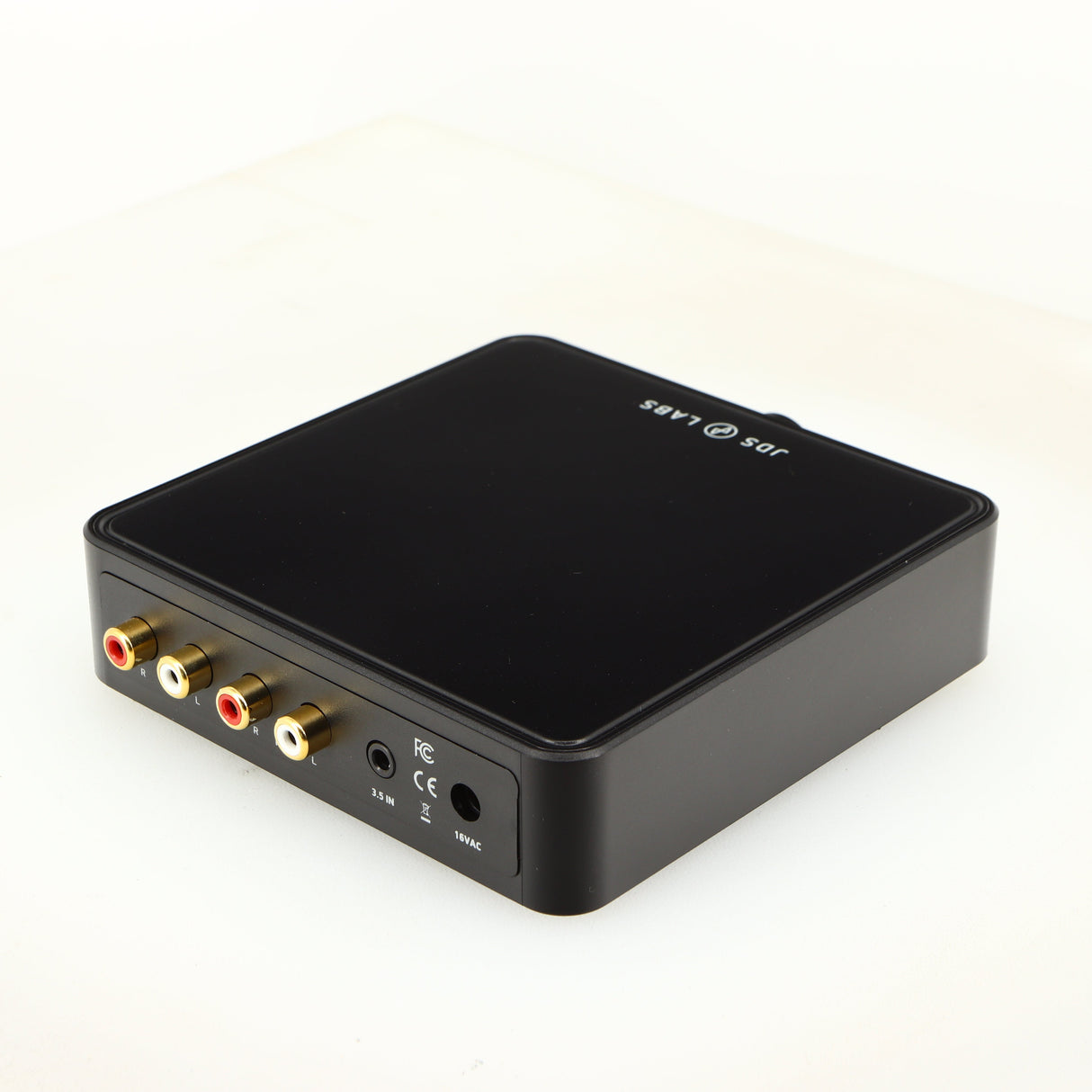Rear left corner of a used JDS Labs Atom Headphone Amplifier in a black finish