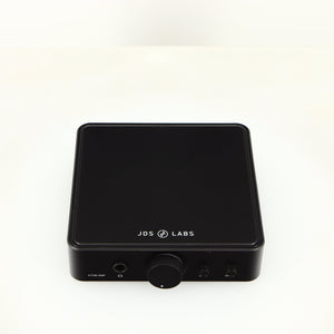 Top of a used JDS Labs Atom Headphone Amplifier in a black finish