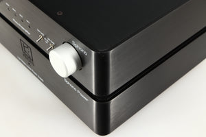 Close up of a used Keces Sphono Phonostage in a black finish showing small chip on front right corner