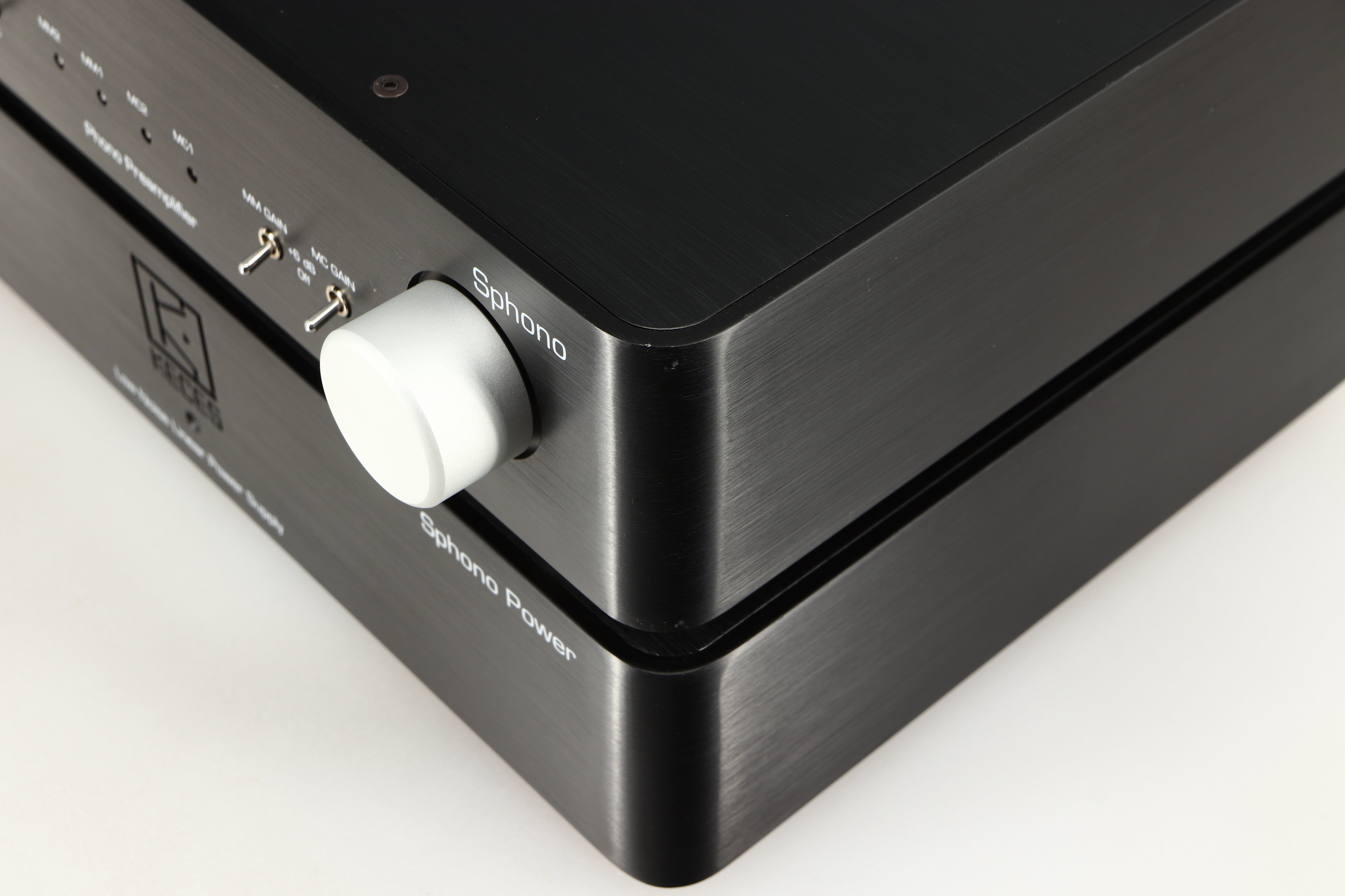Close up of a used Keces Sphono Phonostage in a black finish showing small chip on front right corner