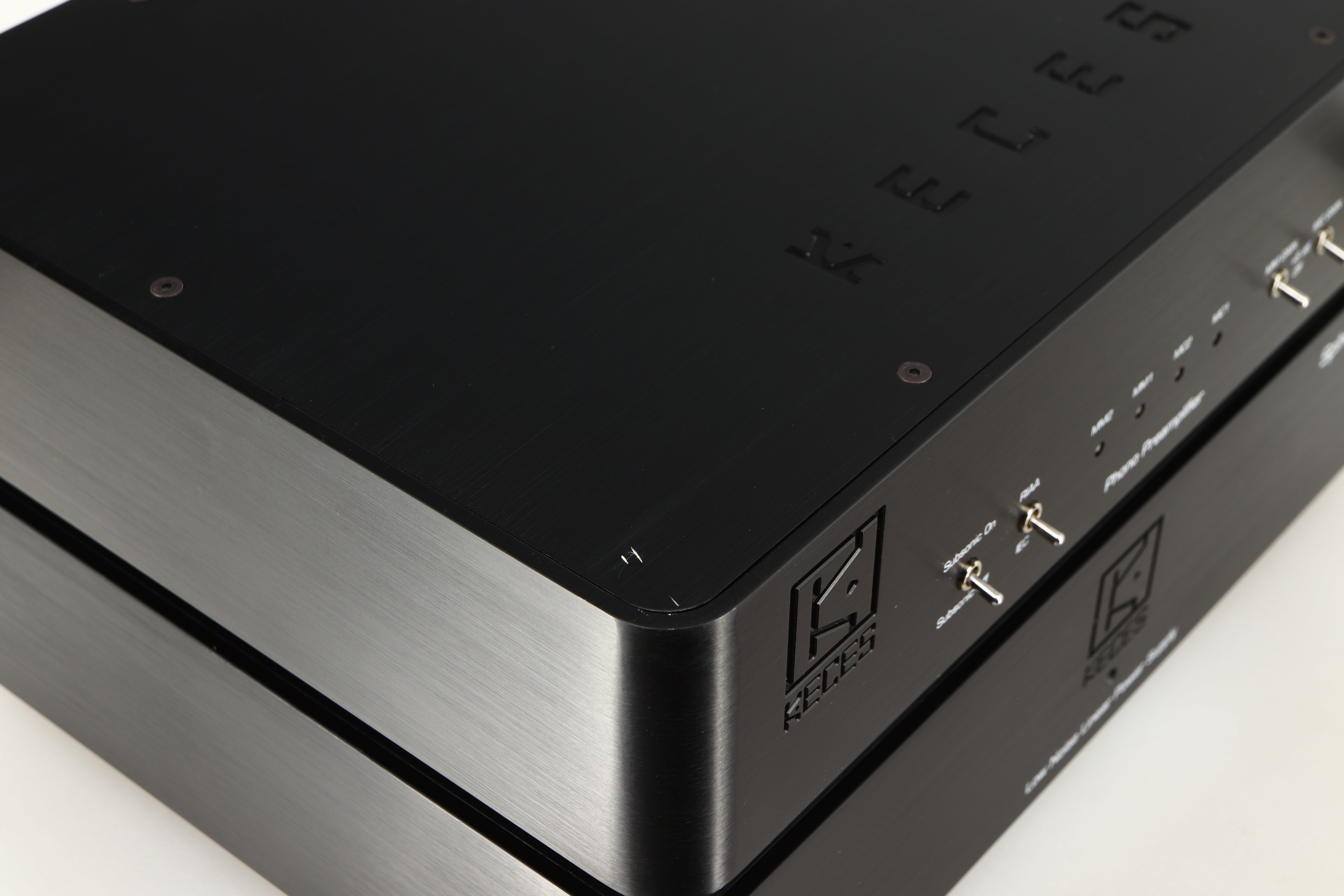 Close up of a used Keces Sphono Phonostage in a black finish showing small scratches on top