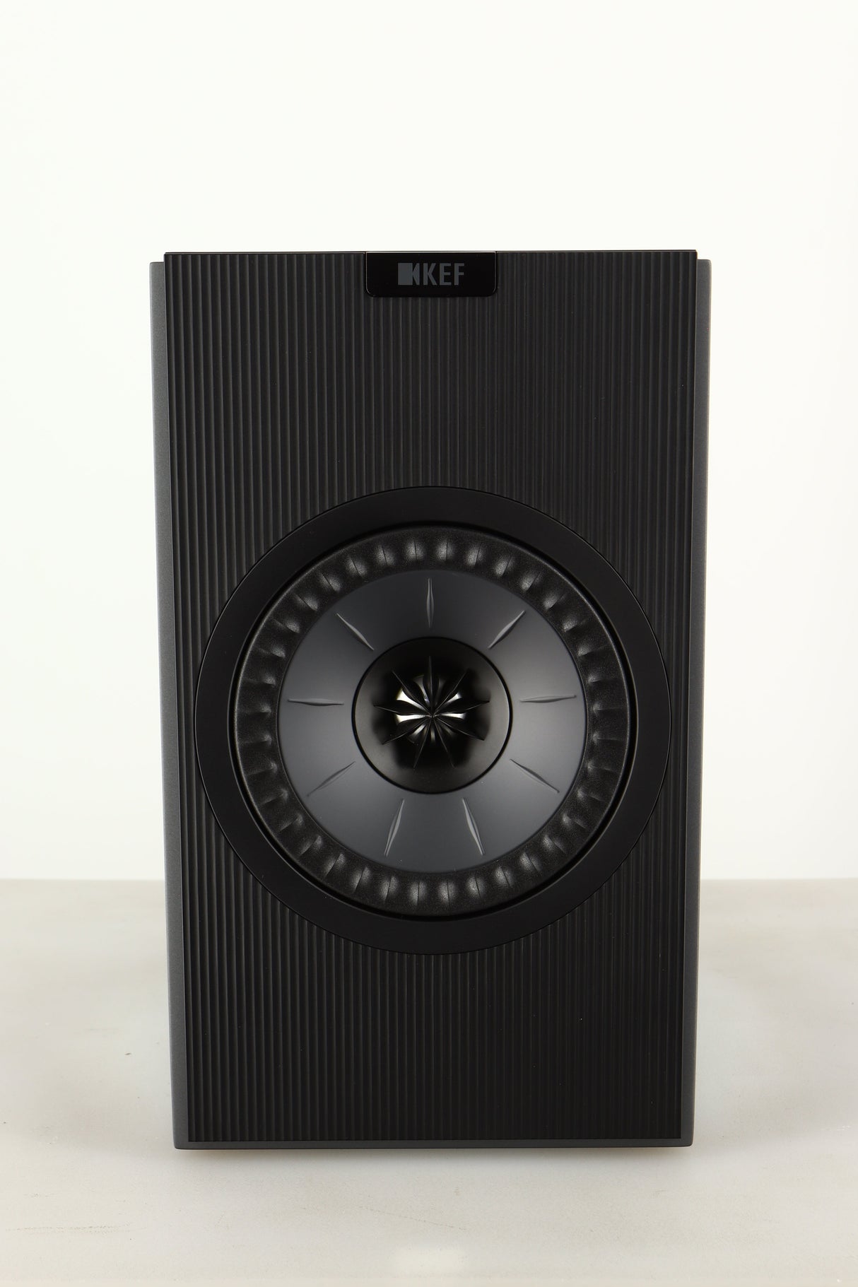 Front view of a used KEF Coda W Active Standmount Speaker in Dark Titanium finish