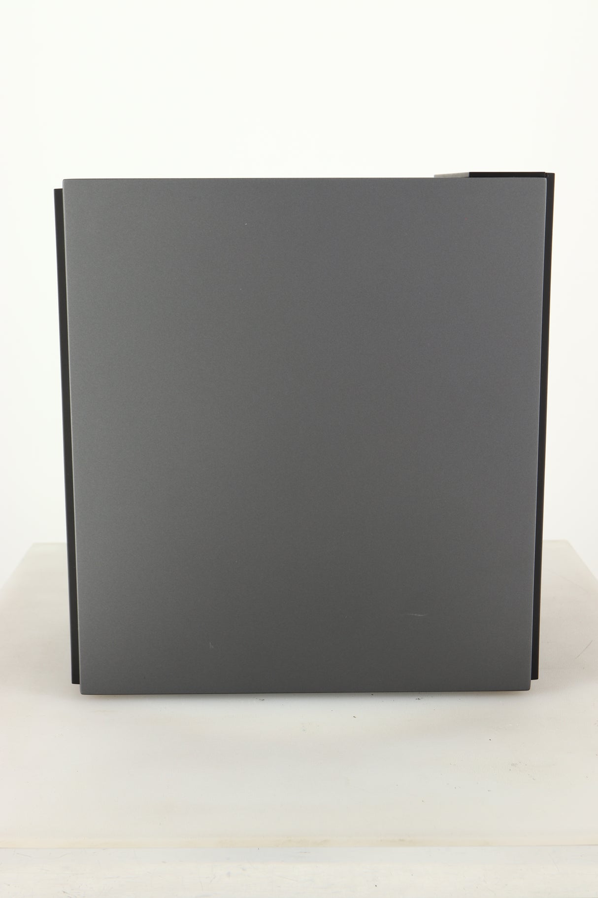 Side view of a used KEF Coda W Active Standmount Speaker in Dark Titanium finish