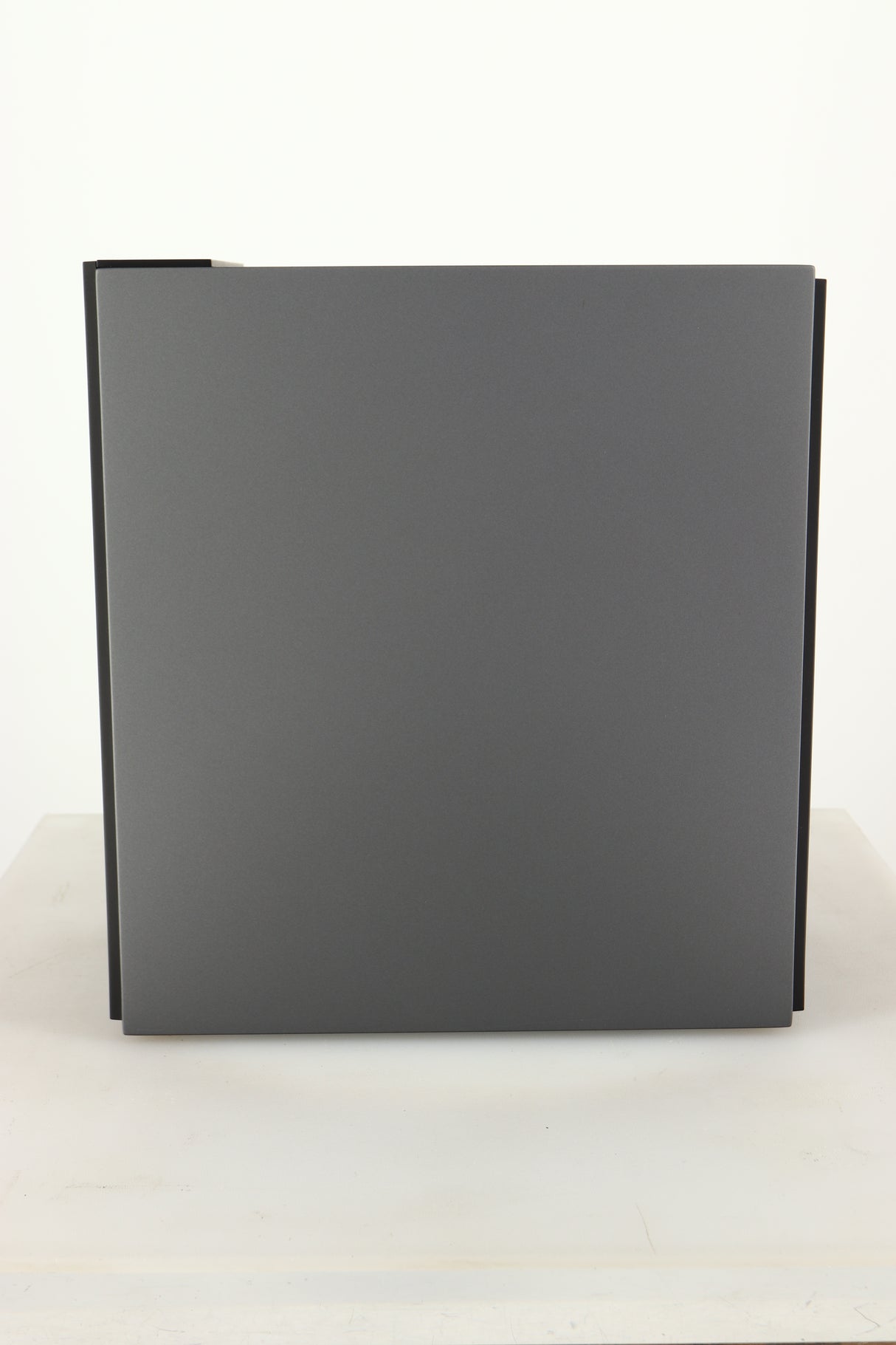 Side view of a used KEF Coda W Active Standmount Speaker in Dark Titanium finish