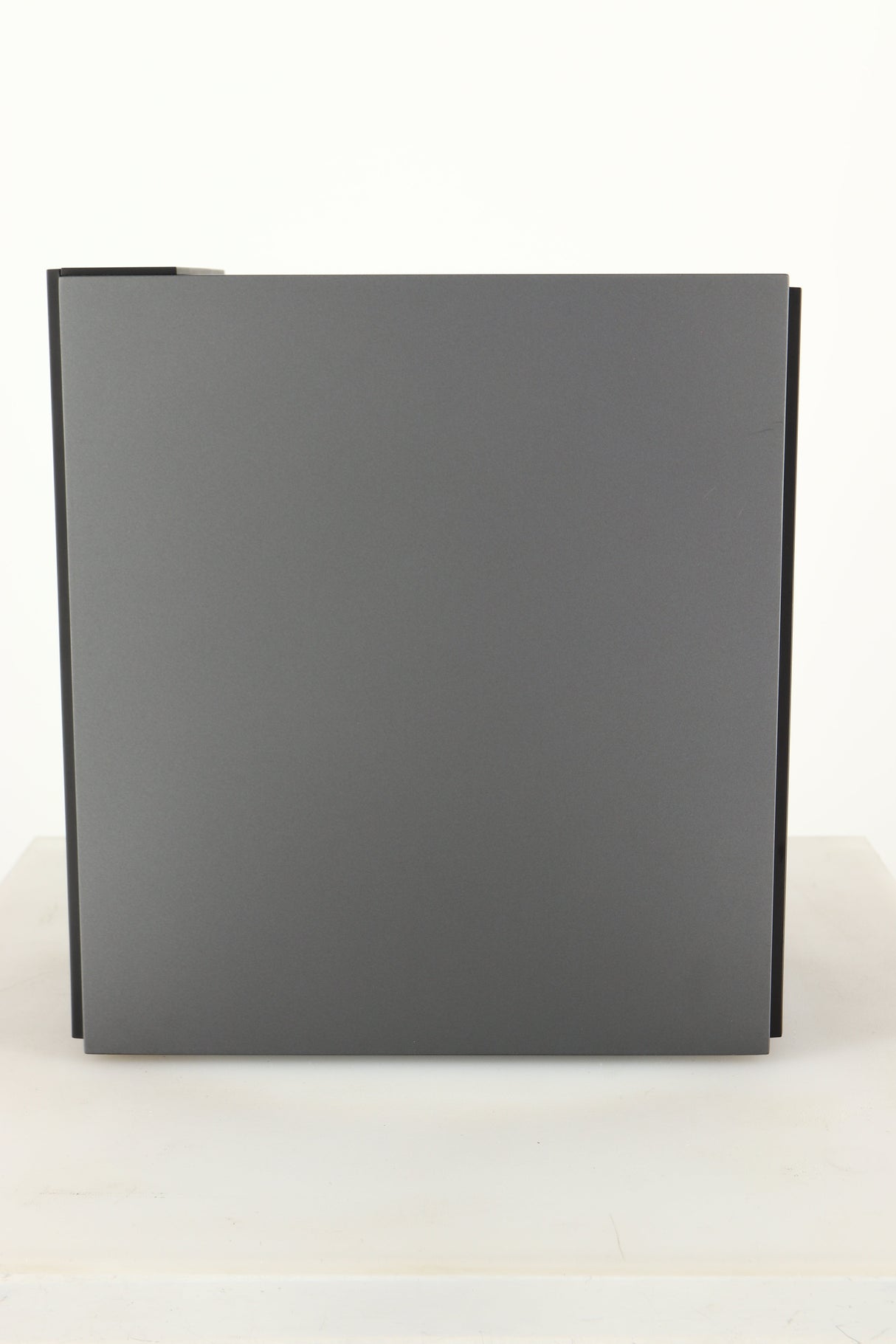 Side view of a used KEF Coda W Active Standmount Speaker in Dark Titanium finish