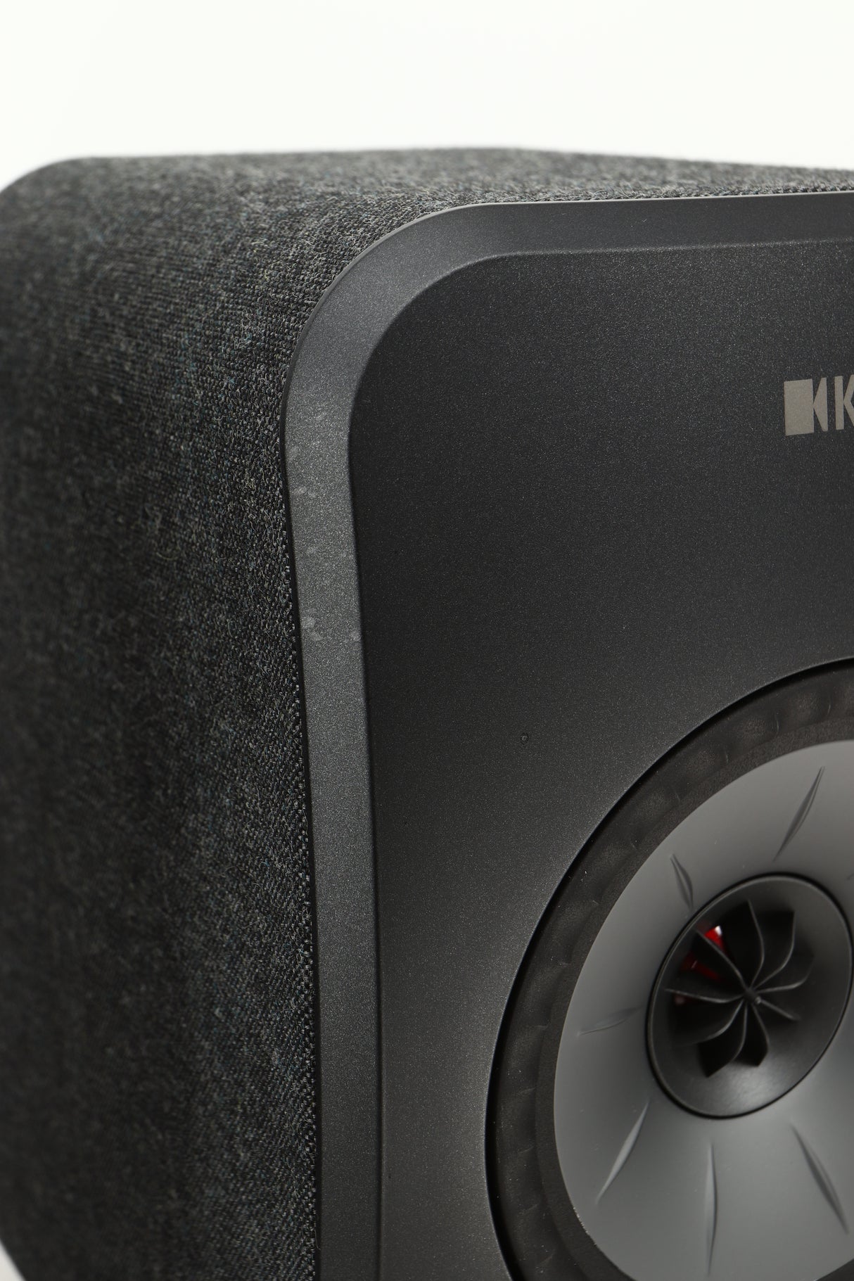 Close up view of a KEF LSX Wireless Standmount Speaker in Black finish
