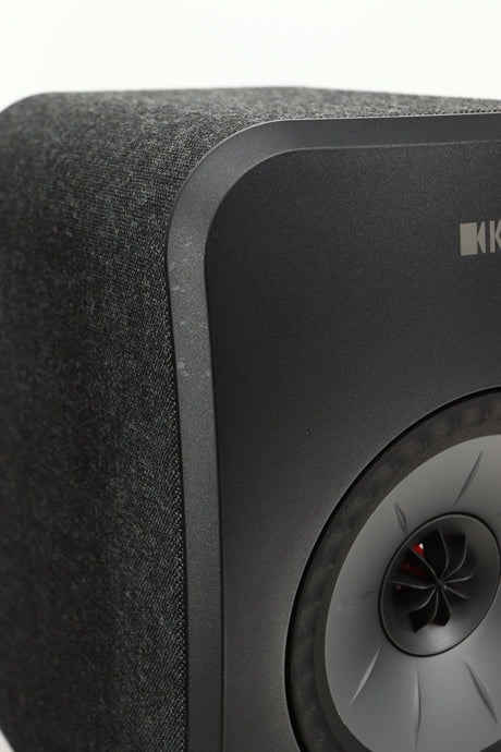 Close up view of a KEF LSX Wireless Standmount Speaker in Black finish