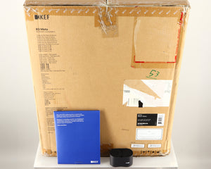 Box for a used KEF R3 Meta Standmount Speaker in a black gloss finish showing Manual and 2x Bungs