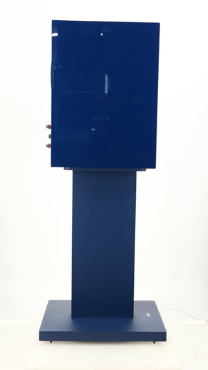 Left side view of a used KEF R3 META Standmount Speaker W/ Stand in an indigo gloss finish