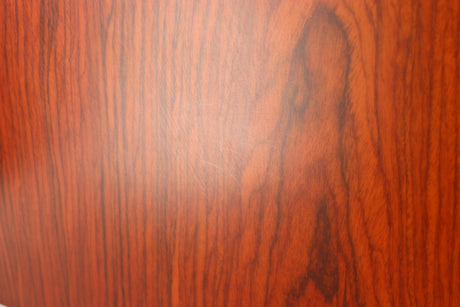 Close up of a used KEF R300 Standmount Speaker in a rosewood finish showing some light scratching on left side
