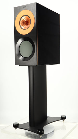 Front right corner of a used KEF Reference 1 Standmount Speaker W/ Stand in a copper black aluminium finish